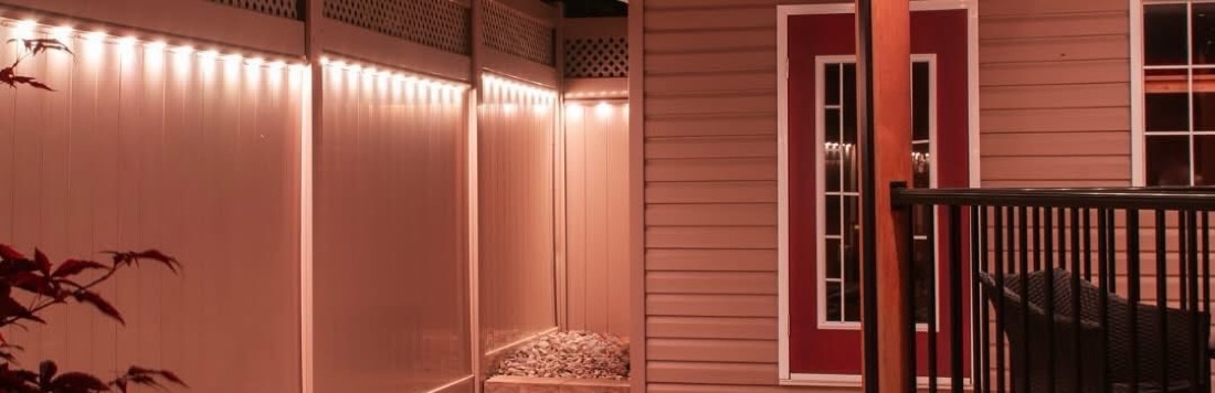 Privacy fence and deck railing with permanent accent lighting