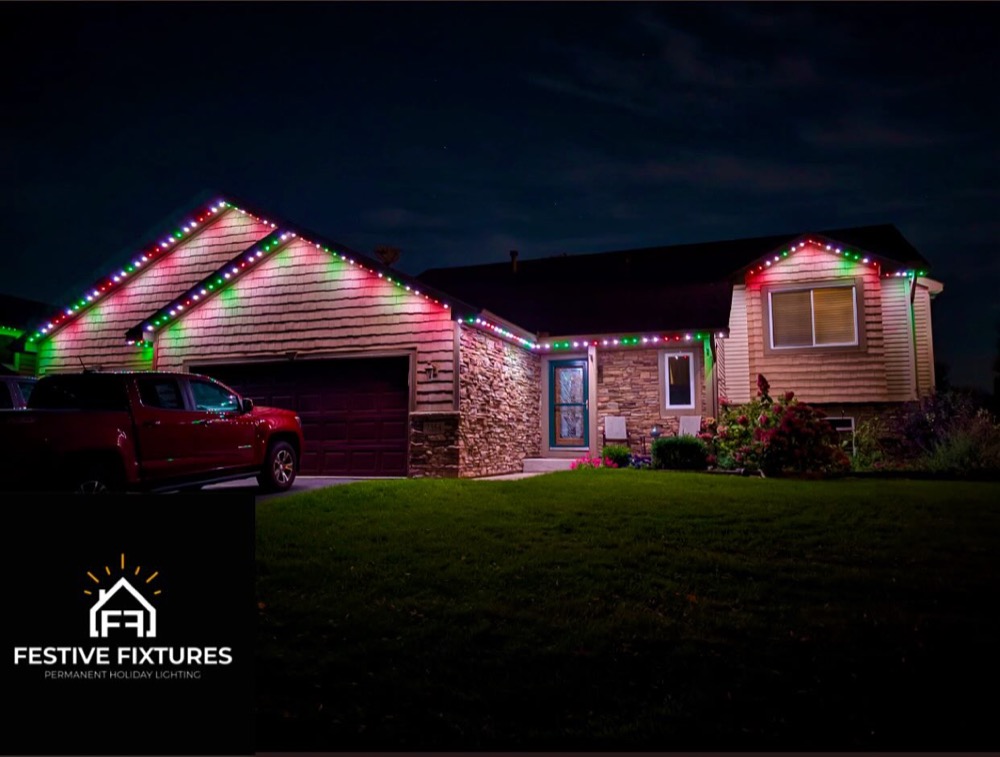 Home with red and green permanent architectural lighting for Christmas